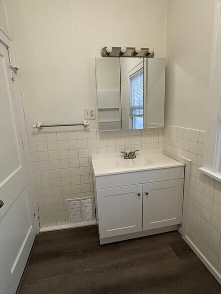 Updated Main floor bathroom - new shower, tub, toilet and vanity - 1003 S Elm Ave