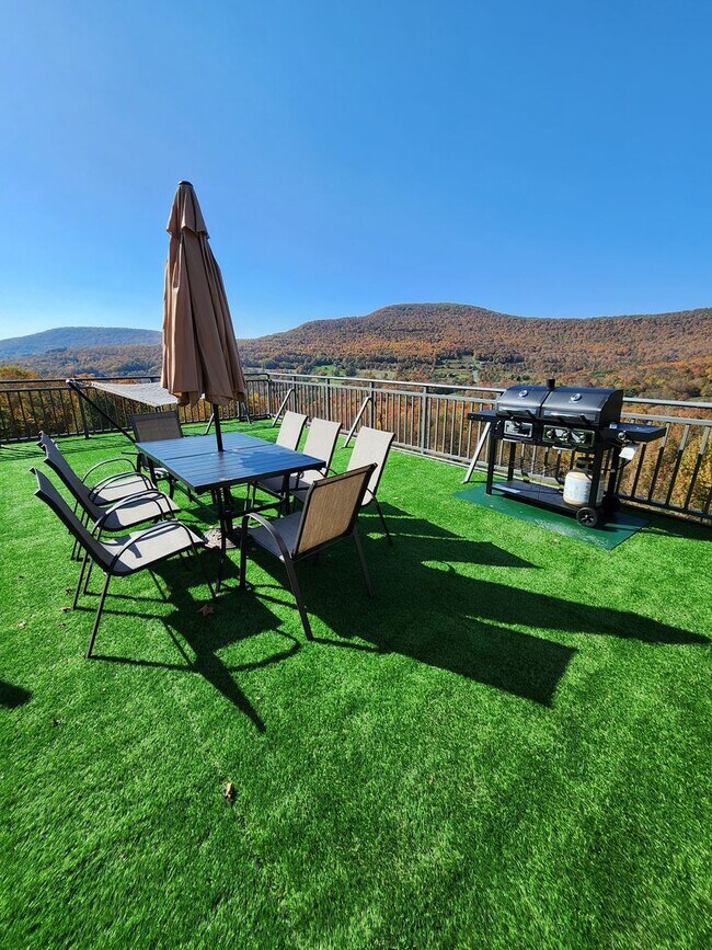 Building Photo - Modern Mountain Retreat with Rooftop Hot T...