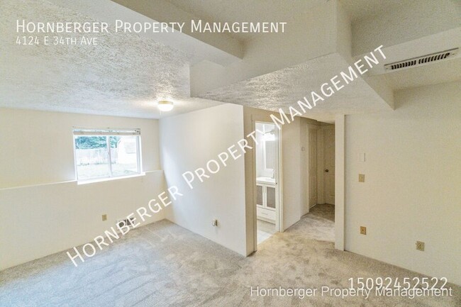 Building Photo - 4124 E 34th Ave