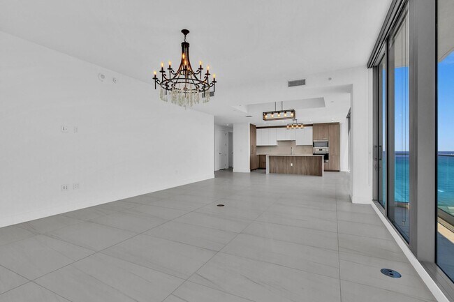 Building Photo - Stunning High-Rise Condo with Ocean Views | Prime Beach Location