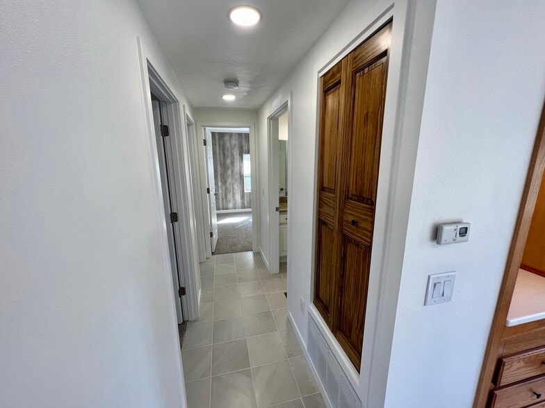 Hallway with linen closet on the right - W4493 Spruce Dr
