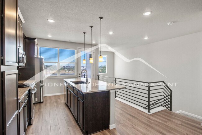 Building Photo - Contemporary Townhome in the Vibrant Interquest Low Maintenance Community with 2 car garage, Wash...