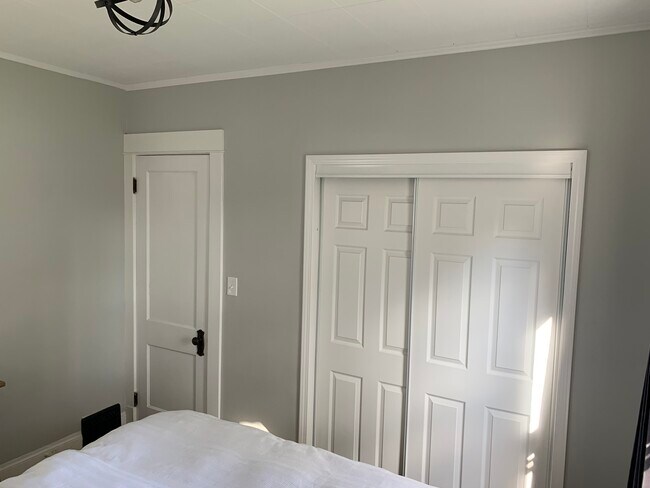 Closets reframed with custom built storage - 1265 Jackson Ave