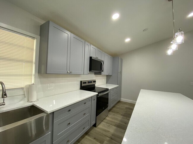 Building Photo - Totally refurbished three bedroom, two bat...