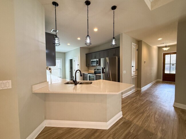 Building Photo - Spacious 3 Bedroom 2 Bath + Office with Split Floor Plan & Screened Patio in Pace!