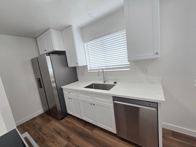 Building Photo - Remodeled 4 Bed, 2 Bath with Double Kitchen & Covered Carport
