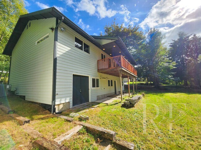 Building Photo - Vaulted Ceilings, Unique Designer Kitchen & Expansive Half-Acre Setting with Flexible Living Spaces