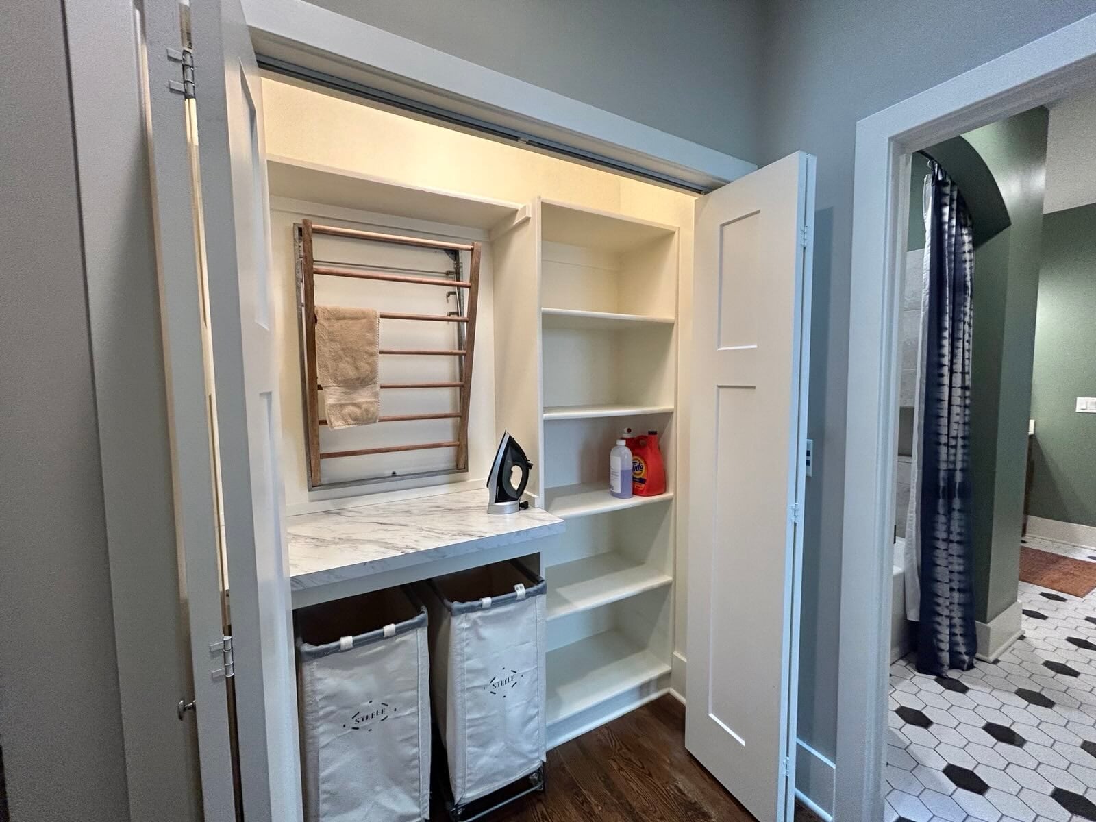 Laundry storage closet and stacked washer/dryer - 405 E 32nd Ave