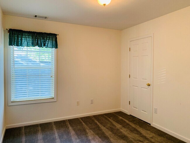 Building Photo - Great location! Lawncare/water is included...