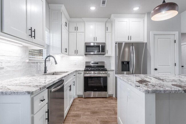 Building Photo - Welcome to this stunning 3-bedroom, 2-bathroom home that boasts a range of high-quality features ...