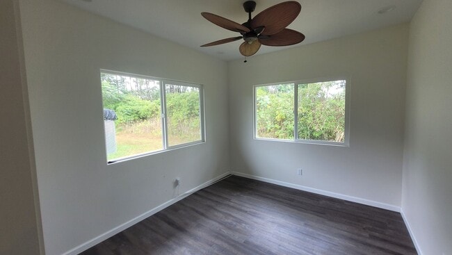 Building Photo - This 3-bedroom, 2-bath home in Orchidland Subdivision
