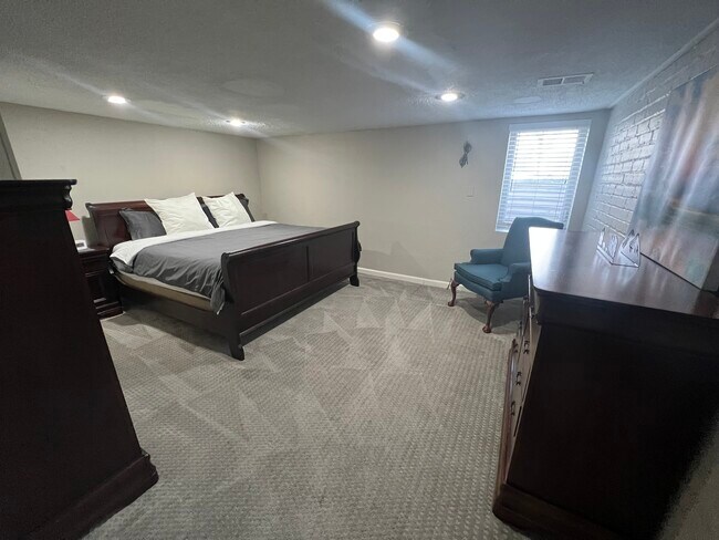 Master bedroom with king sized bed - 2649 W 26th Ave