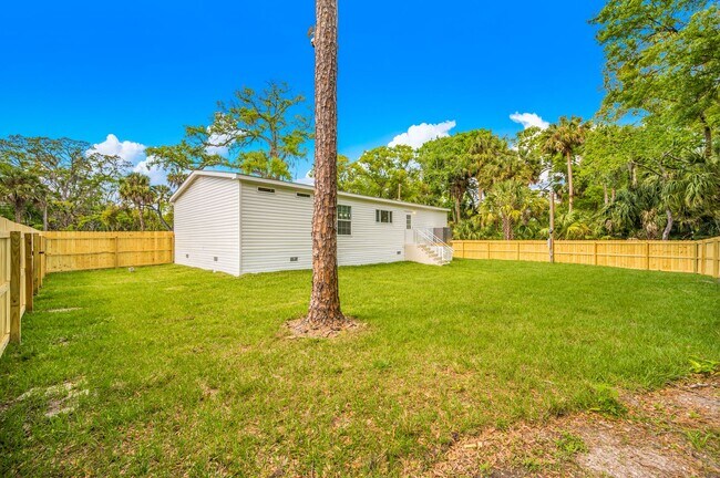 Building Photo - Experience exceptional living at its finest