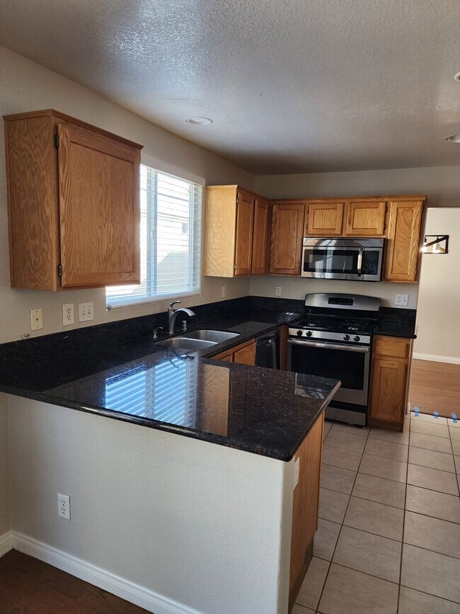 Building Photo - 4 Bedroom, 3 bath, RV parking Separate yard home