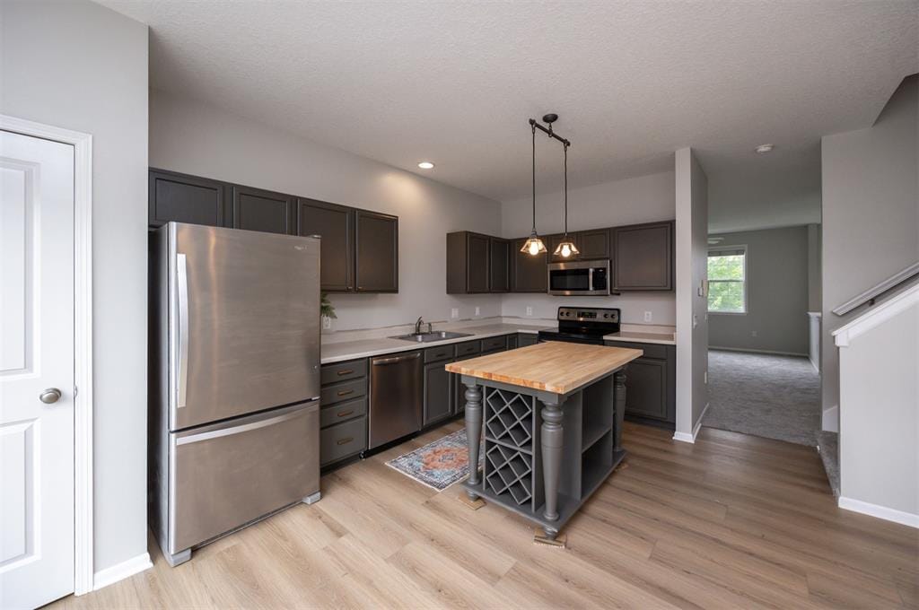 Kitchen: Countertops are now hard stone and faucet is matte black - 928 NE Kamies Ln