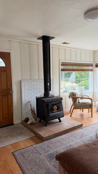 Front door and wood stove - 201 6th Ave