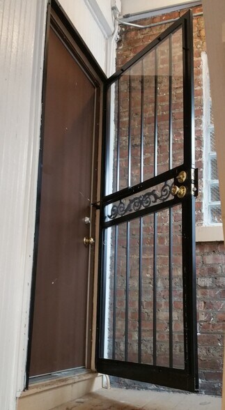 Front and Rear entrances have double steel doors - 7259 S Constance Ave