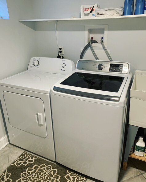 Large laundry room with washer, dryer and utility sink in heated/cooled fully finished basement. - 74 Peters Pl