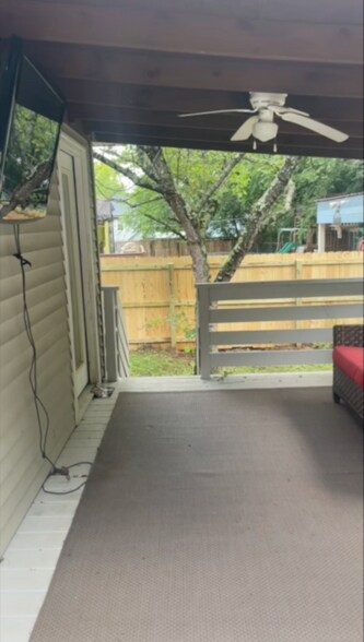 patio covered area with grill and tv - 1122 Woods Edge Dr