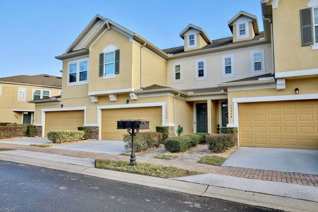 Building Photo - Gorgeous 4/2.5 Spacious Townhome with a Loft Area and a 2 Car Garage in the Desirable Gated Commu...