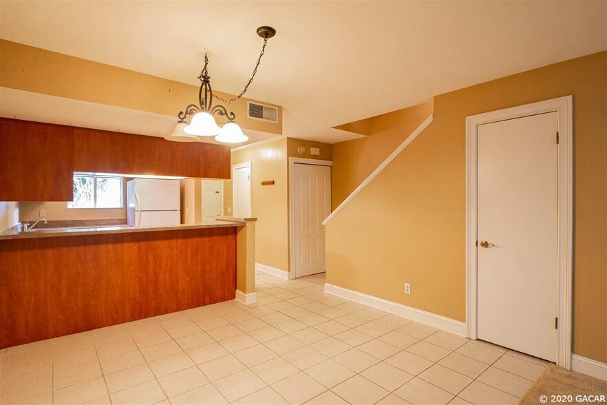 View to kitchen area with pantry and storage closet. - 4411 SW 34th St