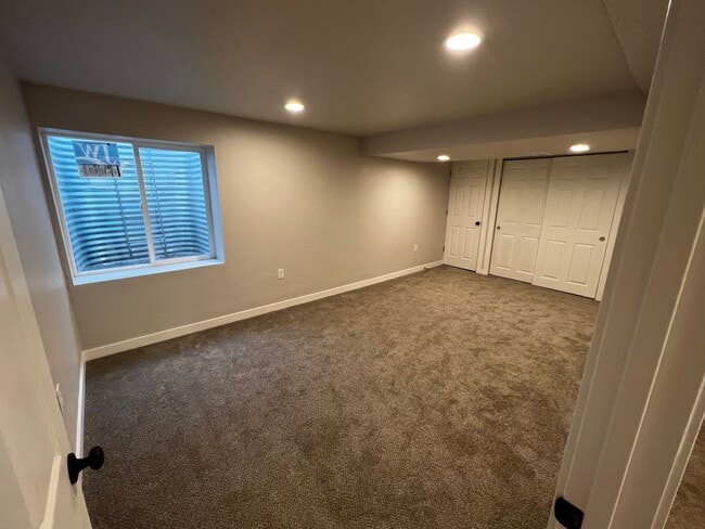 Building Photo - Spacious 4-Bedroom Home with Finished Basement & Garage