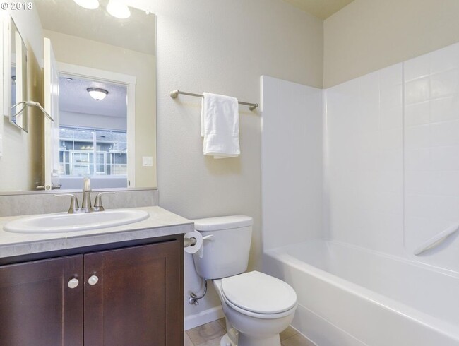 Building Photo - Neat and Tidy Newer Town Home with Two Master Bedrooms and Den on the Main Level