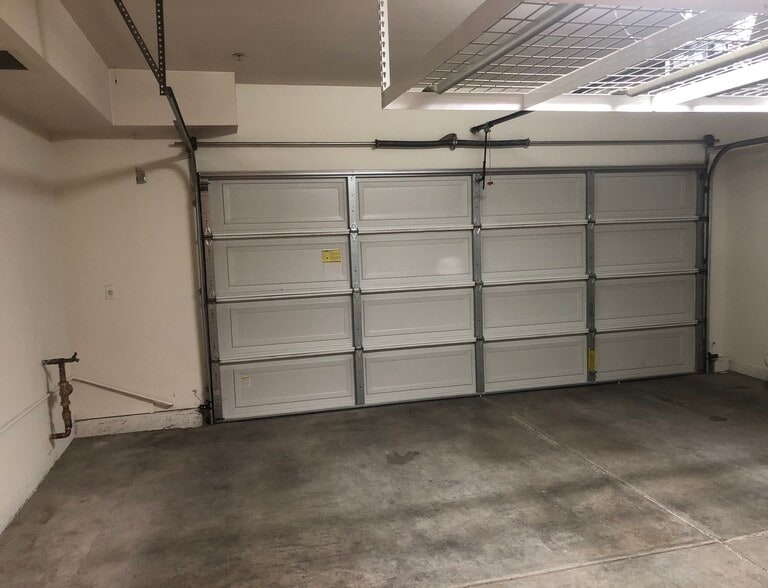 Attached parking for townhome ,extra storage racks , - 6395 Delgado Ln