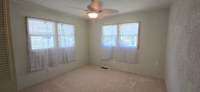 Building Photo - 2 bed 2 baths with carport
