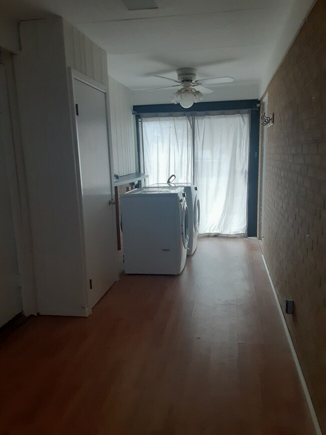 Laundry/storage (partial view). Room long enough for a desk, futon/daybed, or sitting area. - 3210 Grand Blvd