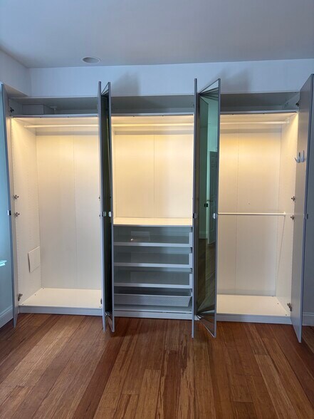 Full Wall of Custom Closets - which light up when opened - 4600 Kenmore Dr NW