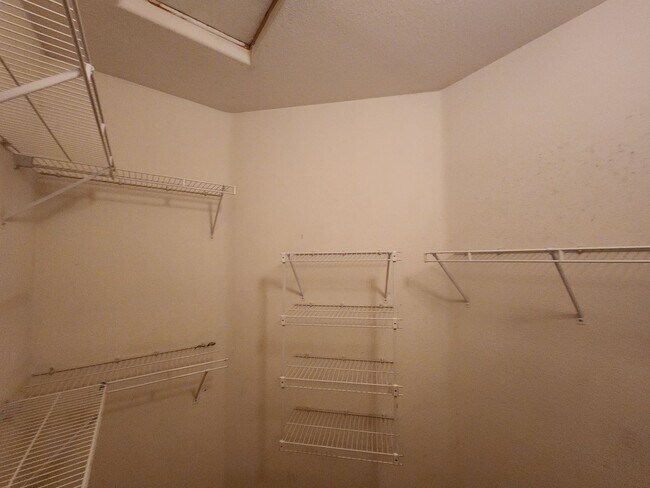 Building Photo - 2nd Story Condo in gated community close to the pool.