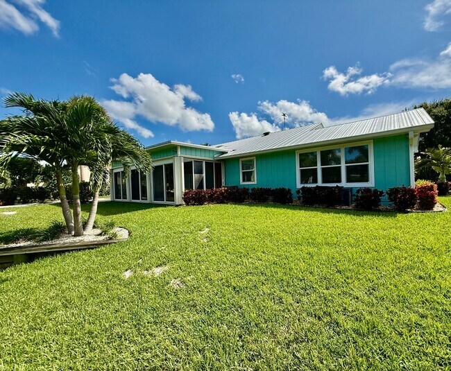 Building Photo - Palm City Home with Dock and Lift