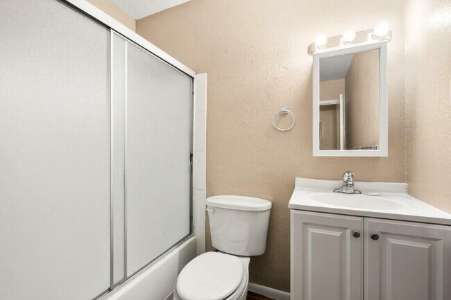 Experience modern elegance with this well-lit and stylishly designed bathroom. - 1690 EATON
