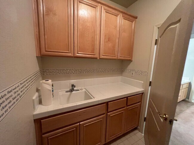 Building Photo - 4 bedrooms with 3 car garage in Rose Lane ...