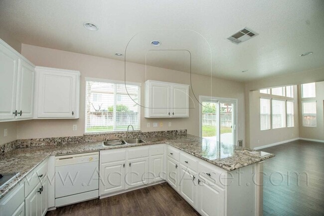 Building Photo - Open-Concept 4BD Home with Granite Counters & Attached Two-Car Garage