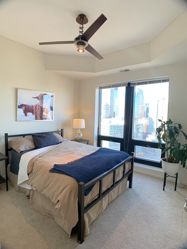 Bedroom features a contemporary ceiling fan (w remote) that produces a soothing quiet breeze. - 500 E Grant St