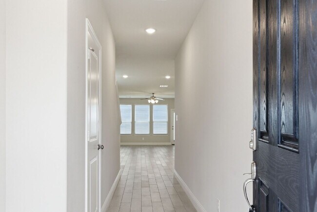 Building Photo - "Open-Concept 4-Bedroom, 2.5-Bath with Designer Finishes and Peaceful Greenbelt Views!"