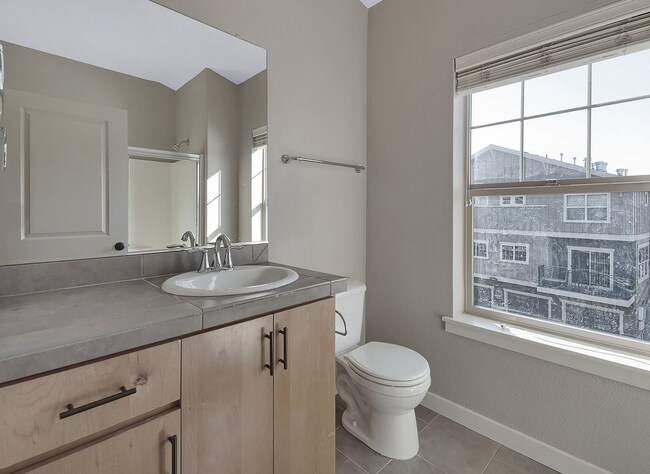 Building Photo - 2BR + 2.1BA Corner Townhome-Style Condo — Dual Primary Suites, Attached Garage & Most Utilities I...