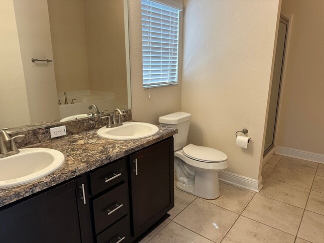 Building Photo - Spacious 4 Bedroom Home with Fenced Yard a...