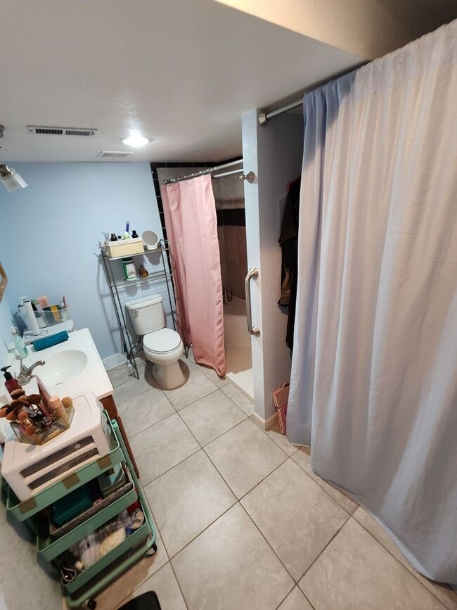 Building Photo - Spacious 4-Bedroom Home with RV Parking in...
