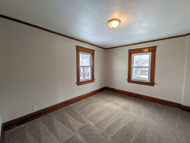 Building Photo - Large 4 Bedroom Home with Garage, Deck, & Fence!