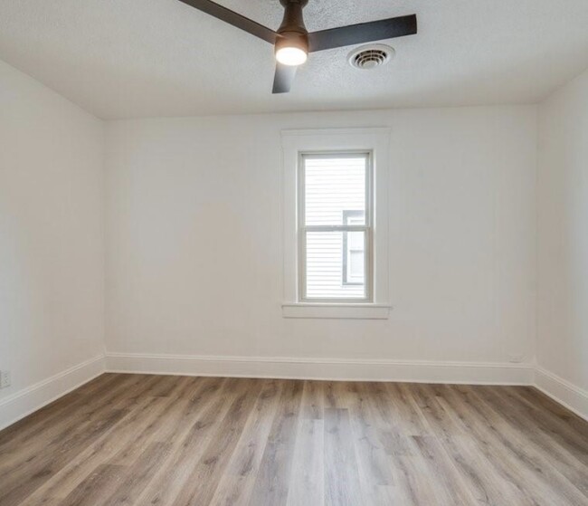 secondary bedroom, features remote controlled lighting/ceiling fan - 3317 W 41st St