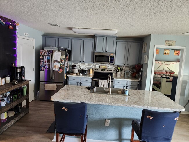 Beautifully painted cabinets with nicely finished hardware. - 2142 Pebble Point Dr