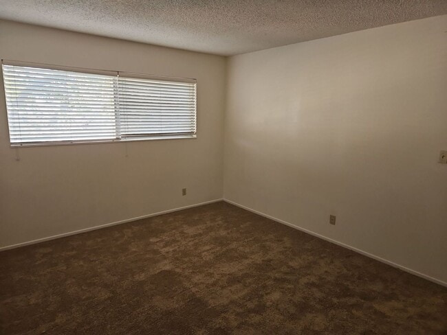 Building Photo - Spacious 4-Bedroom Home with Large Backyard & Covered Patio!