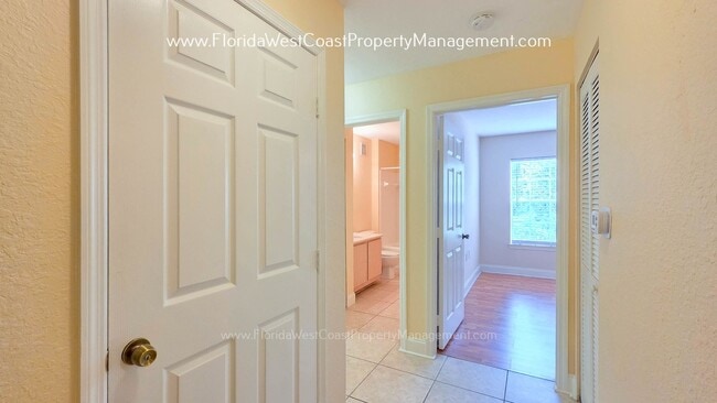 Building Photo - MOVE IN READY! LARGE 2 BEDROOM/2 BATH PLUS ATTACHED GARAGE! TILE/LVP THROUGHOUT!