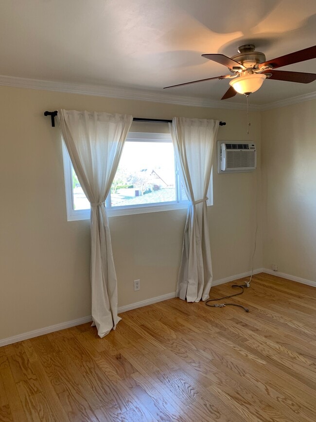 Bedroom #1 with drapes and A/C - 204 W Fairview Ave