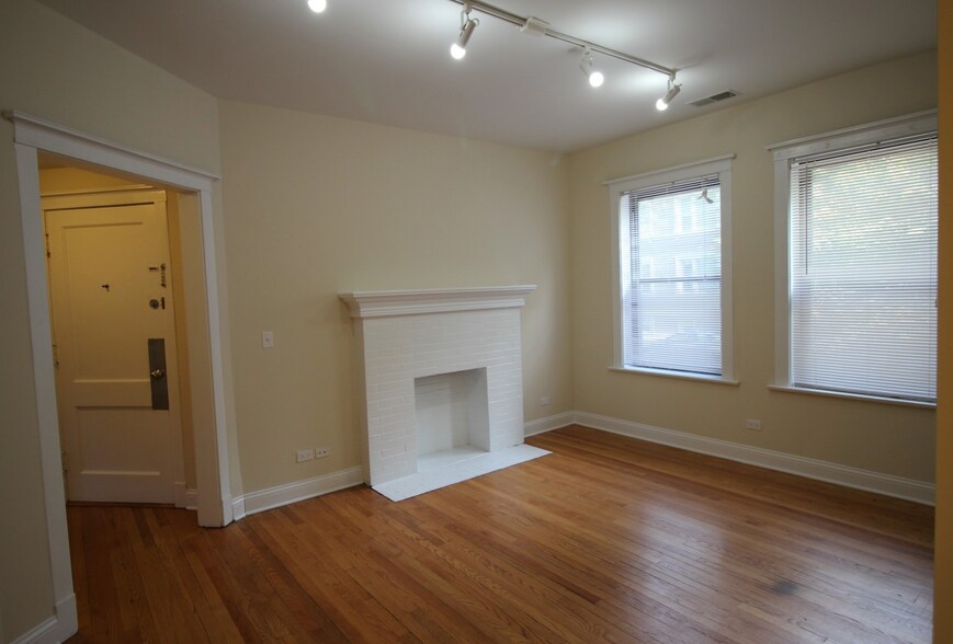 Spacious living room with Decorative Fireplace - 6718 N Lakewood Ave
