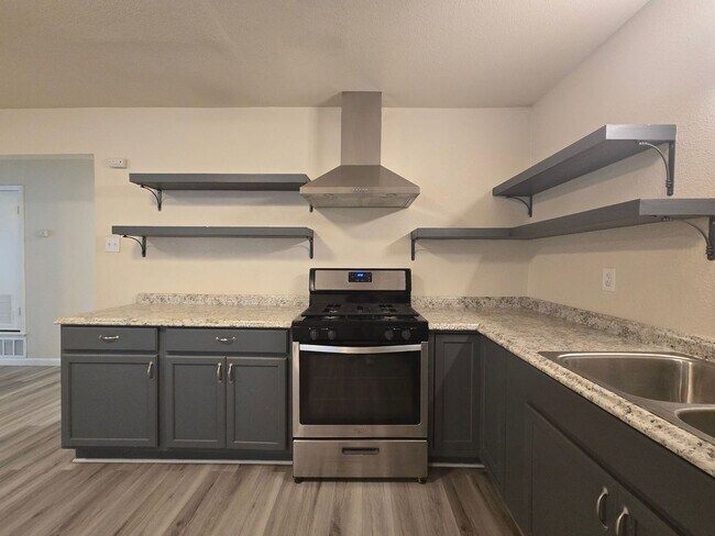 Building Photo - RENT REDUCTION - AVAILABLE NOW!