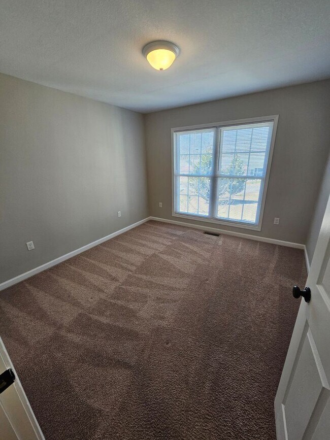 Building Photo - Spacious 3-Bedroom Home in Crossville with 2-Car Garage, Fenced Yard & Porches